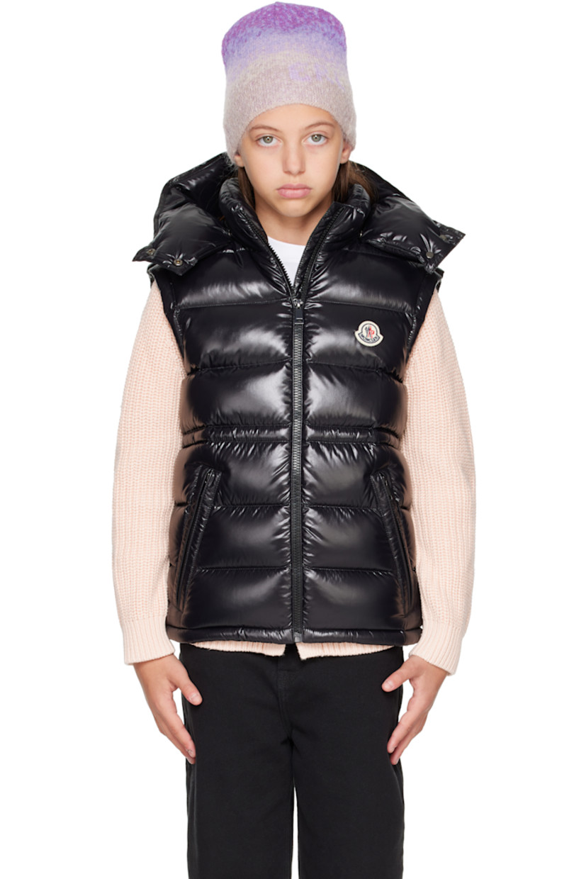 Down-filled and quilted nylon laqué vest.

· DIST-certified down
· Detachable hood at stand collar
· Zip closure
· Felted logo patch at chest
· Zip pockets at front
· Elasticized hem
· Bungee-style drawstring at interior waist
· Fully lined

Supplier color: Black

Model measures 55" / 139.7 cm tall and wears size 12Y.

Moncler Enfant Size: child's height
8Y: 51.2" / 130 cm 
10Y: 55.2" / 140 cm 
12Y: 59.8" / 152 cm 
14Y: 64.6" / 164 cm