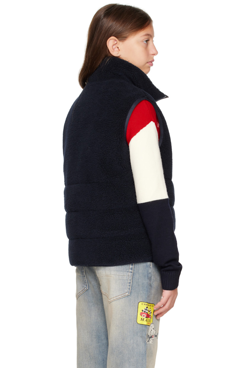 Insulated sherpa fleece vest.

· Stand collar
· Zip closure
· Felted logo patch at chest
· Seam pockets
· Full satin lining

Supplier color: Blue navy

Model measures 55" / 139.7 cm tall and wears size 12Y.

Moncler Enfant Size: child's height
8Y: 51.2" / 130 cm 
10Y: 55.2" / 140 cm 
12Y: 59.8" / 152 cm 
14Y: 64.6" / 164 cm