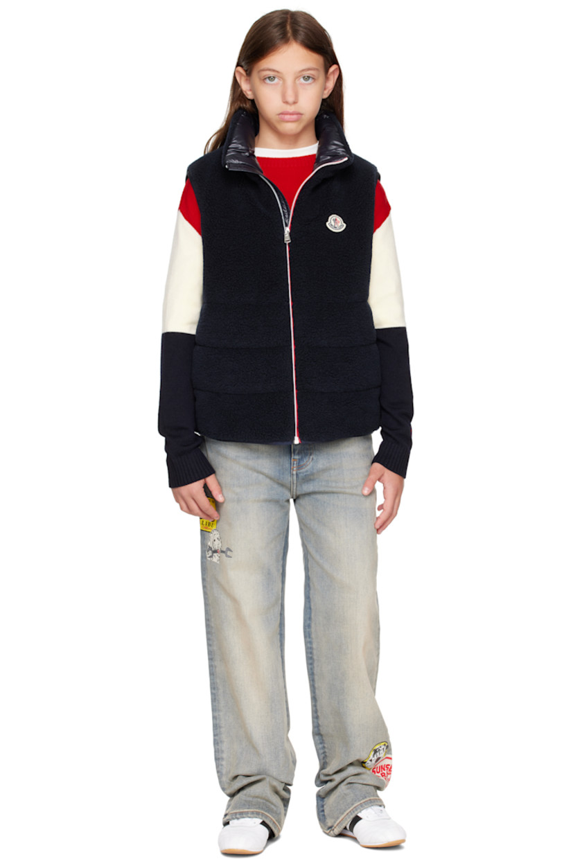 Insulated sherpa fleece vest.

· Stand collar
· Zip closure
· Felted logo patch at chest
· Seam pockets
· Full satin lining

Supplier color: Blue navy

Model measures 55" / 139.7 cm tall and wears size 12Y.

Moncler Enfant Size: child's height
8Y: 51.2" / 130 cm 
10Y: 55.2" / 140 cm 
12Y: 59.8" / 152 cm 
14Y: 64.6" / 164 cm