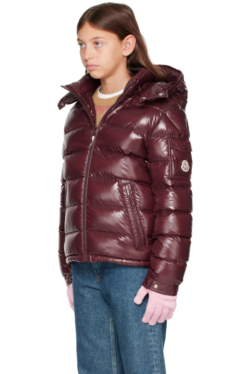 Down-filled and quilted nylon laqué jacket.

· DIST-certified down
· Detachable hood at stand collar
· Zip closure
· Zip pockets at front
· Flap pocket and felted logo patch at sleeve
· Adjustable press-stud fastening at elasticized cuffs
· Fully lined

Supplier color: Bordeaux

Model measures 55" / 139.7 cm tall and wears size 12Y.

Moncler Enfant Size: child's height
8Y: 51.2" / 130 cm 
10Y: 55.2" / 140 cm 
12Y: 59.8" / 152 cm 
14Y: 64.6" / 164 cm