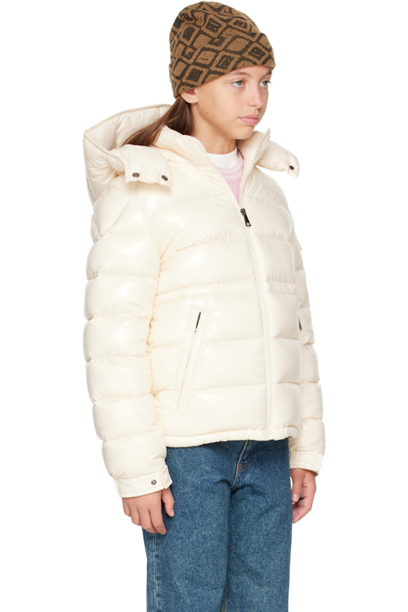 Down-filled and quilted nylon laqué jacket.

· DIST-certified down
· Detachable hood at stand collar
· Zip closure
· Zip pockets at front
· Elasticized hem
· Flap pocket and felted logo patch at sleeve
· Adjustable press-stud fastening at elasticized cuffs
· Bungee-style drawstring at interior waist
· Fully lined

Supplier color: White

Model measures 55" / 139.7 cm tall and wears size 12Y.

Moncler Enfant Size: child's height
8Y: 51.2" / 130 cm 
10Y: 55.2" / 140 cm 
12Y: 59.8" / 152 cm 
14Y: 64.6" / 164 cm