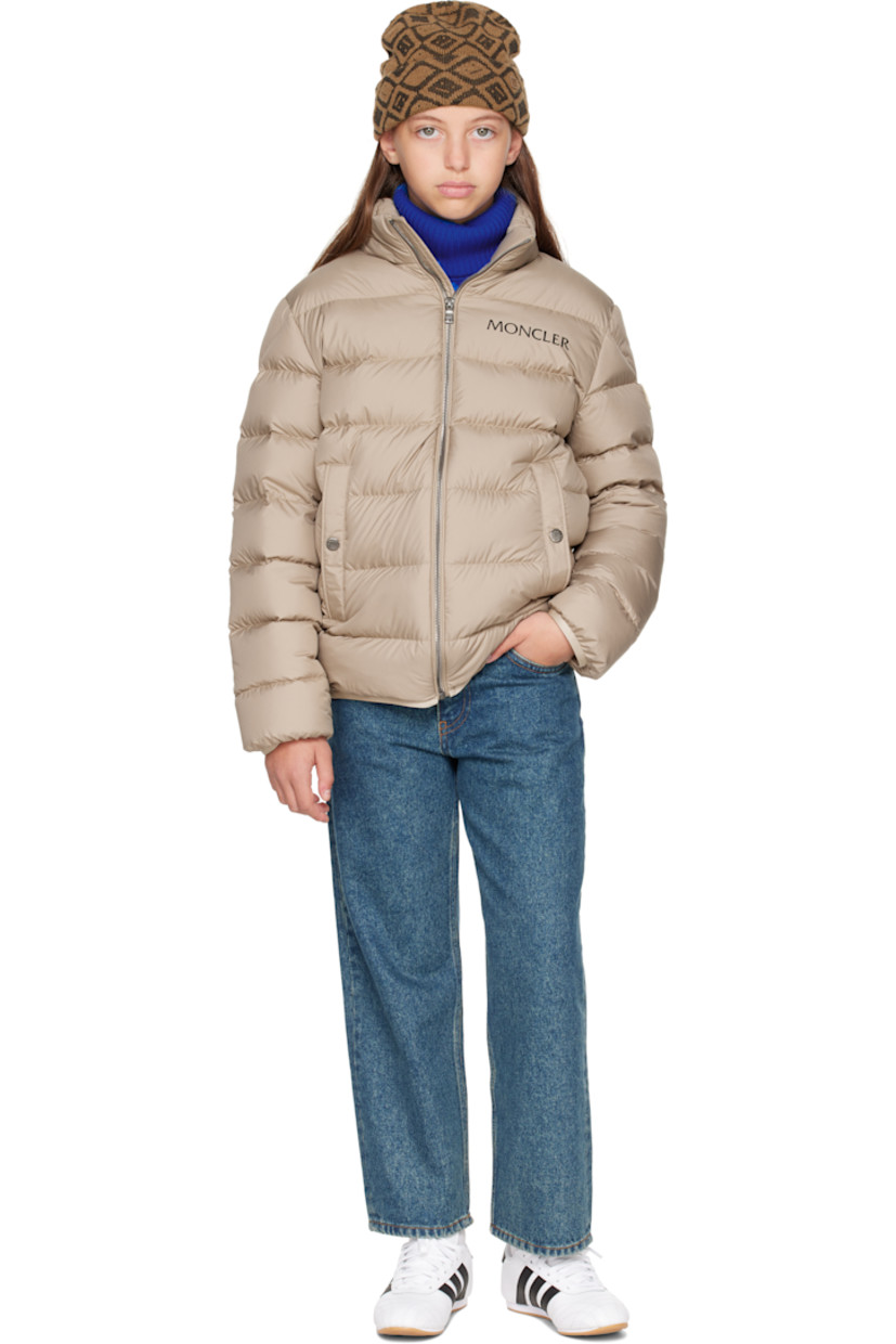 Down-filled and quilted recycled polyester satin jacket.

· DIST-certified down
· Stowaway hood at stand collar
· Zip closure
· Logo printed at chest
· Welt pockets  at front
· Elasticized hem and cuffs
· Felted logo patch at sleeve
· Fully lined

Supplier color: Light beige

Model measures 55" / 139.7 cm tall and wears size 12Y.

Moncler Enfant Size: child's height
8Y: 51.2" / 130 cm 
10Y: 55.2" / 140 cm 
12Y: 59.8" / 152 cm 
14Y: 64.6" / 164 cm