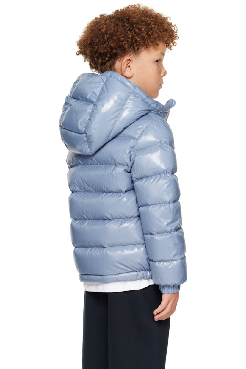 Down-filled and quilted nylon satin jacket. 

· DIST-certified down
· Hood at stand collar
· Zip closure
· Welt pockets at front
· Elasticized hem and cuffs
· Felted logo patch at sleeve
· Fully lined
· Hand-wash

Supplier color: Light blue

Model measures 48.5" / 123.2 cm tall and wears size 8Y.

Moncler Enfant Size: child's height
8Y: 51.2" / 130 cm 
10Y: 55.2" / 140 cm 
12Y: 59.8" / 152 cm 
14Y: 64.6" / 164 cm 

Fill: 90% goose down, 10% feather.