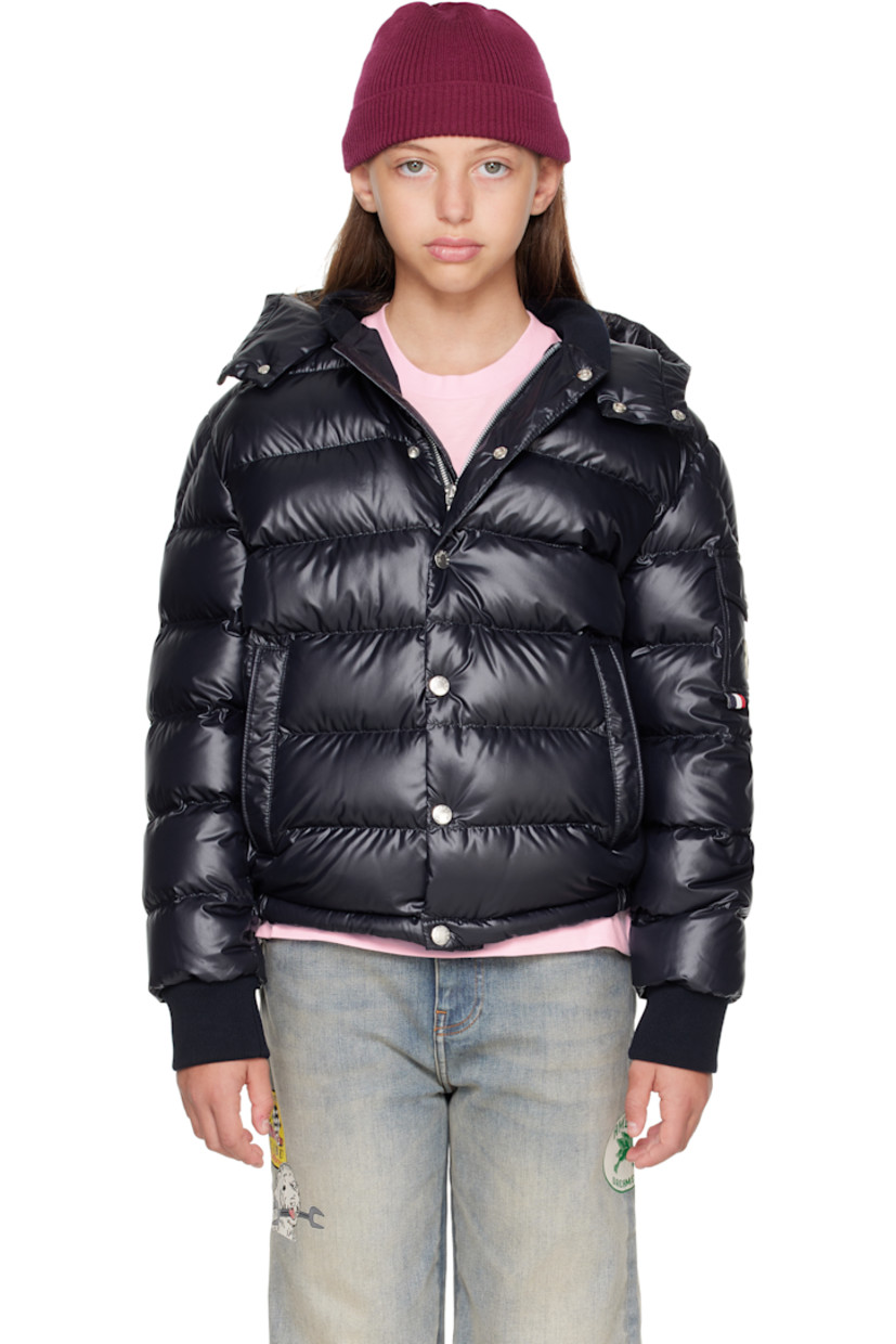 Down-filled and quilted satin jacket.

· DIST-certified down
· Detachable hood at stand collar
· Zip closure with press-stud placket
· Welt pockets at front
· Elasticized hem
· Flap pocket and felted logo patch at sleeve
· Rib-knit cuffs
· Fully lined

Supplier color: Blue navy

Model measures 55" / 139.7 cm tall and wears size 12Y.

Moncler Enfant Size: child's height
8Y: 51.2" / 130 cm 
10Y: 55.2" / 140 cm 
12Y: 59.8" / 152 cm 
14Y: 64.6" / 164 cm