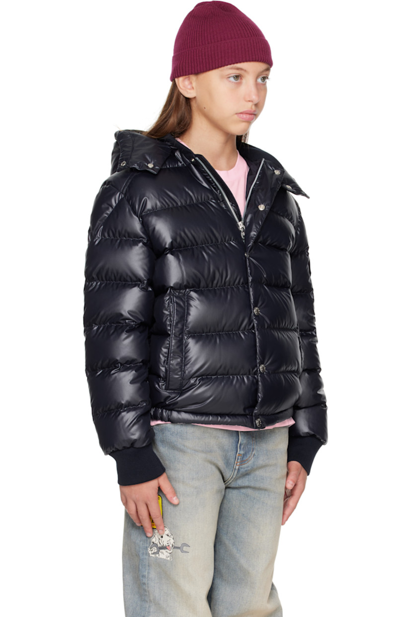Down-filled and quilted satin jacket.

· DIST-certified down
· Detachable hood at stand collar
· Zip closure with press-stud placket
· Welt pockets at front
· Elasticized hem
· Flap pocket and felted logo patch at sleeve
· Rib-knit cuffs
· Fully lined

Supplier color: Blue navy

Model measures 55" / 139.7 cm tall and wears size 12Y.

Moncler Enfant Size: child's height
8Y: 51.2" / 130 cm 
10Y: 55.2" / 140 cm 
12Y: 59.8" / 152 cm 
14Y: 64.6" / 164 cm
