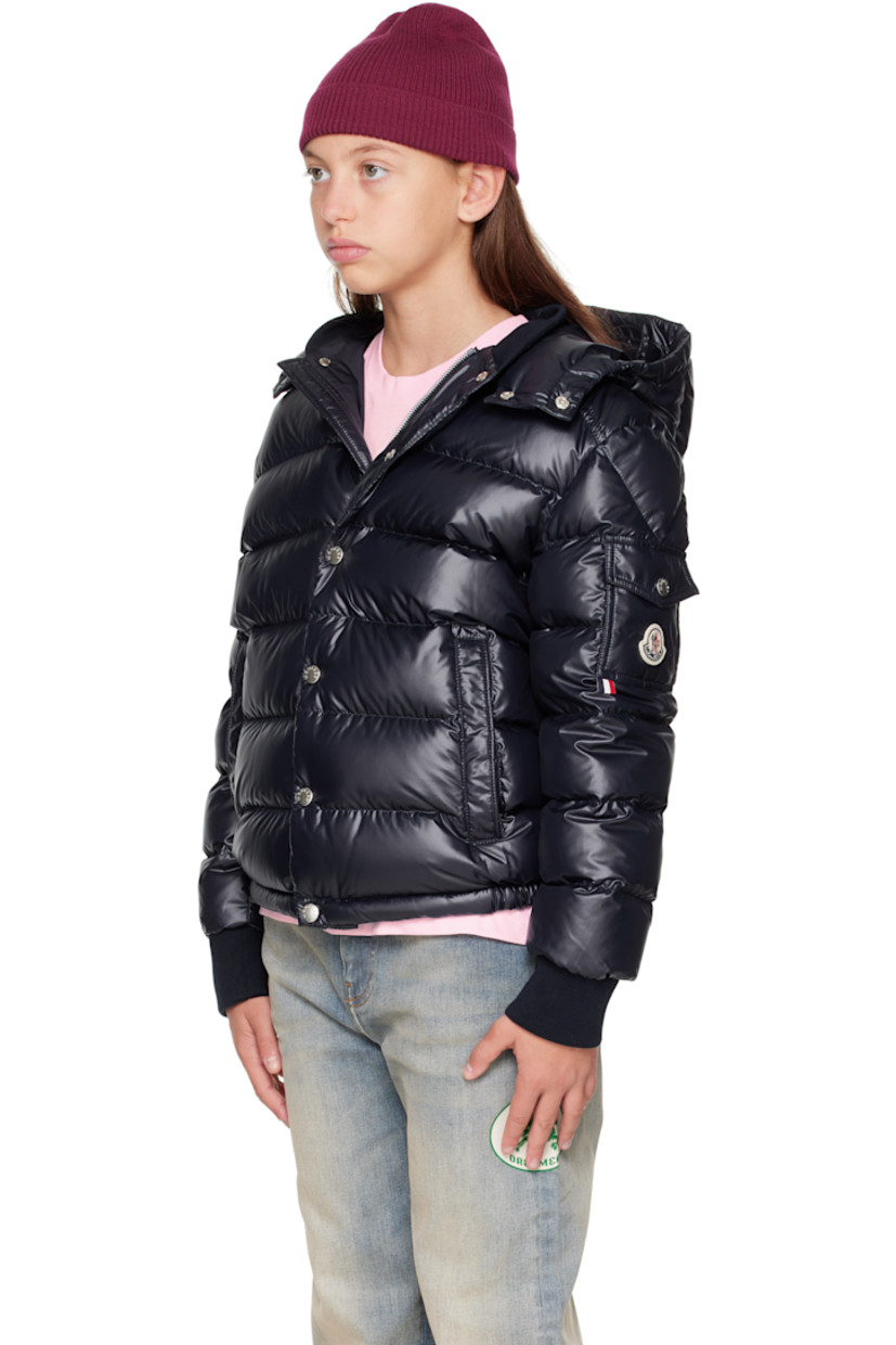 Down-filled and quilted satin jacket.

· DIST-certified down
· Detachable hood at stand collar
· Zip closure with press-stud placket
· Welt pockets at front
· Elasticized hem
· Flap pocket and felted logo patch at sleeve
· Rib-knit cuffs
· Fully lined

Supplier color: Blue navy

Model measures 55" / 139.7 cm tall and wears size 12Y.

Moncler Enfant Size: child's height
8Y: 51.2" / 130 cm 
10Y: 55.2" / 140 cm 
12Y: 59.8" / 152 cm 
14Y: 64.6" / 164 cm