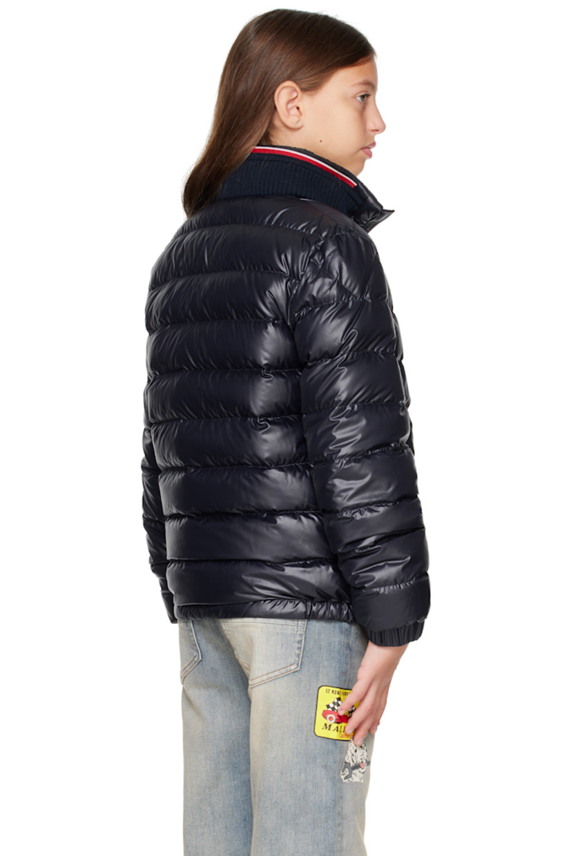 Down-filled and quilted recycled polyester satin jacket. 

· DIST-certified down
· Rib-knit stand collar
· Zip closure
· Welt pockets at front
· Partially elasticized hem
· Felted logo patch at sleeve
· Elasticized cuffs
· Fully lined

Supplier color: Blue navy

Model measures 55" / 139.7 cm tall and wears size 12Y.

Moncler Enfant Size: child's height
8Y: 51.2" / 130 cm 
10Y: 55.2" / 140 cm 
12Y: 59.8" / 152 cm 
14Y: 64.6" / 164 cm