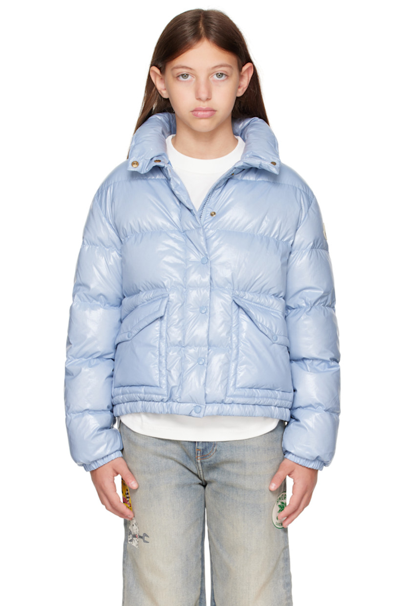 Down-filled and quilted nylon satin jacket.

· DIST-certified down
· Funnel neck
· Zip closure with press-stud placket
· Flap pockets at front
· Elasticized hem and cuffs
· Felted logo patch at sleeve
· Fully lined

Supplier color: Light blue

Model measures 55" / 139.7 cm tall and wears size 12Y.

Moncler Enfant Size: child's height
8Y: 51.2" / 130 cm 
10Y: 55.2" / 140 cm 
12Y: 59.8" / 152 cm 
14Y: 64.6" / 164 cm
