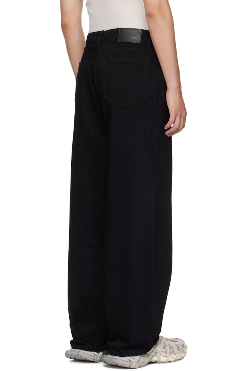 Non-stretch denim jeans.

· Wide-leg
· Mid-rise 
· Belt loops
· Five-pocket styling
· Zip fly
· Logo patch at back waistband

Supplier color: Black tint