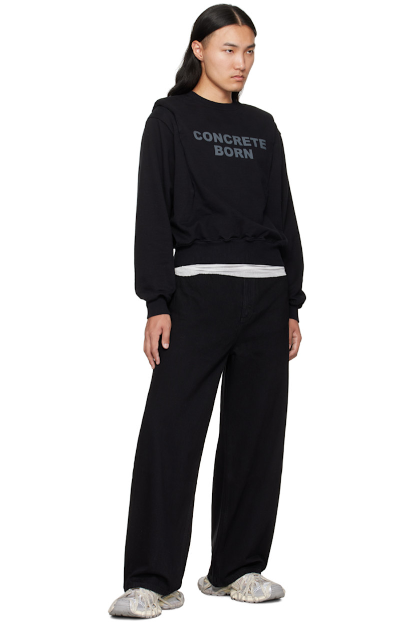 Non-stretch denim jeans.

· Wide-leg
· Mid-rise 
· Belt loops
· Five-pocket styling
· Zip fly
· Logo patch at back waistband

Supplier color: Black tint