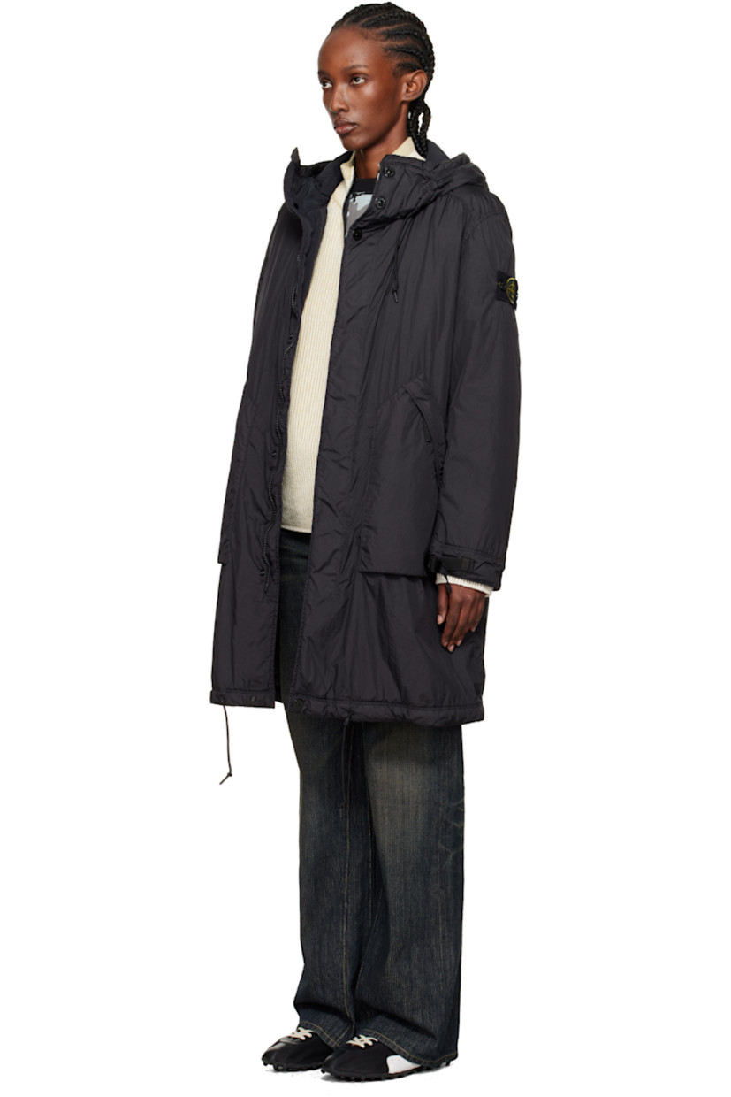 PrimaLoft®-TC-insulated nylon taffeta coat.

· Water-resistant anti-drop coating
· Garment-dyed
· Cord-lock drawstring at hood
· Two-way zip closure with press-stud placket
· Zip pockets at front
· Cord-lock drawstring at hem
· Detachable felted logo patch at sleeve
· Cinch strap at cuffs
· Full quilted satin lining

Supplier color: Black