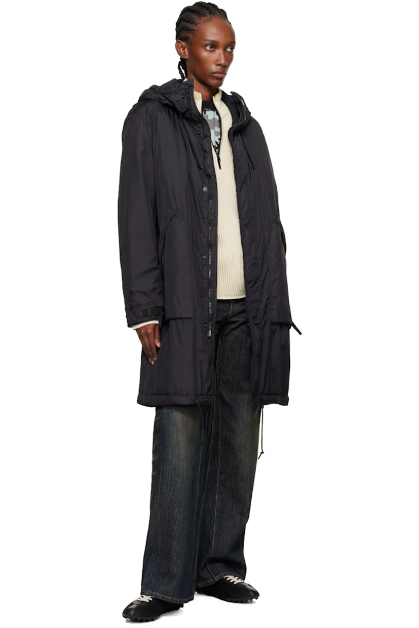 PrimaLoft®-TC-insulated nylon taffeta coat.

· Water-resistant anti-drop coating
· Garment-dyed
· Cord-lock drawstring at hood
· Two-way zip closure with press-stud placket
· Zip pockets at front
· Cord-lock drawstring at hem
· Detachable felted logo patch at sleeve
· Cinch strap at cuffs
· Full quilted satin lining

Supplier color: Black