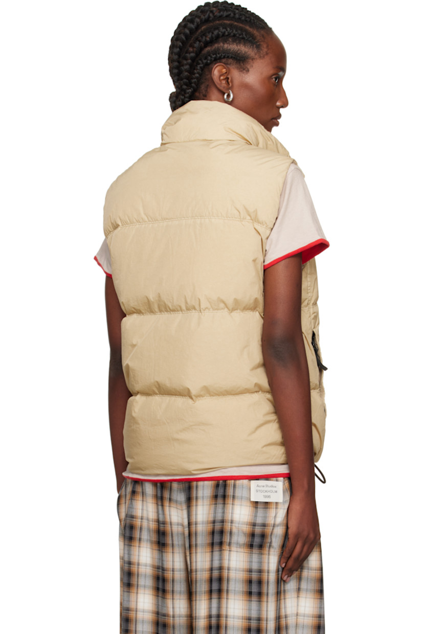 Down-filled crinkled recycled nylon taffeta vest.

· Wind-resistant and water-resistant 
· Garment-dyed and anti-drop coated
· RDS-certified down
· Funnel neck
· Two-way zip closure with press-stud placket
· Flap pocket at chest
· Zip pockets
· Concealed bungee-style drawstring at hem
· Detachable felted logo patch at side seam
· Patch pocket at interior
· Resin-coated taffeta lining

Supplier color: Desert

Fill: 80% duck down, 20% duck feather.