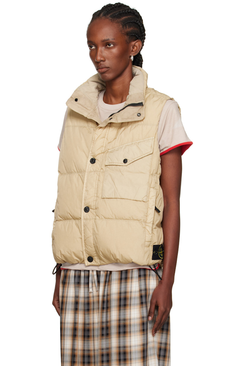 Down-filled crinkled recycled nylon taffeta vest.

· Wind-resistant and water-resistant 
· Garment-dyed and anti-drop coated
· RDS-certified down
· Funnel neck
· Two-way zip closure with press-stud placket
· Flap pocket at chest
· Zip pockets
· Concealed bungee-style drawstring at hem
· Detachable felted logo patch at side seam
· Patch pocket at interior
· Resin-coated taffeta lining

Supplier color: Desert

Fill: 80% duck down, 20% duck feather.