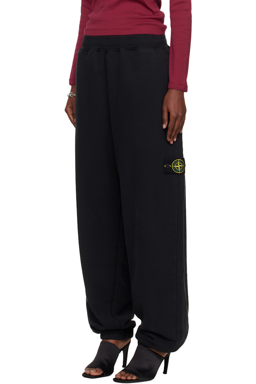 Loose-fit garment-dyed organic cotton fleece lounge pants.

· Overlock stitching throughout
· Concealed drawstring at elasticized waistband
· Three-pocket styling
· Elasticized cuffs
· Detachable felted logo patch at outseam
· Logo-engraved silver-tone hardware

Supplier color: Black