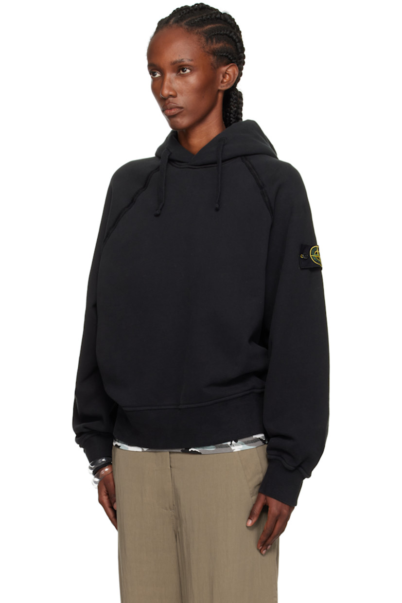 Oversized garment-dyed organic cotton fleece hoodie.

· Drawstring at hood
· Rib-knit hem and cuffs
· Exposed seam at raglan sleeves
· Detachable felted logo patch at sleeve

Supplier color: Black