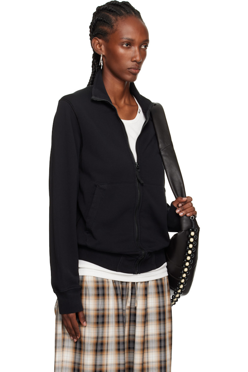 Garment-dyed organic cotton French terry jacket.

· Overlock stitching throughout
· Stand collar
· Zip closure
· Patch pockets
· Rib-knit hem and cuffs
· Detachable felted logo patch at sleeve

Supplier color: Black