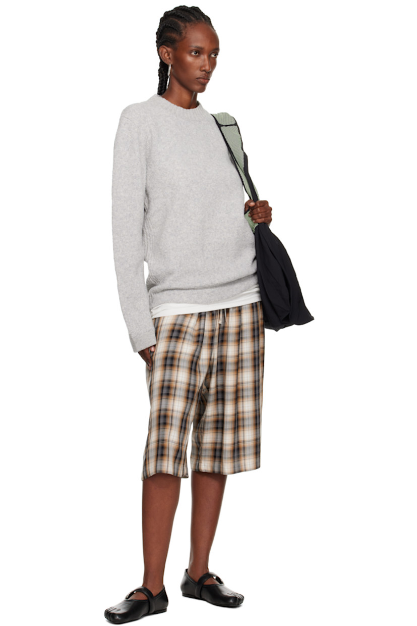 Brushed knit wool-blend sweater.

· Rib-knit crewneck, hem, and cuffs
· Detachable felted logo patch at sleeve

Supplier color: Melange grey