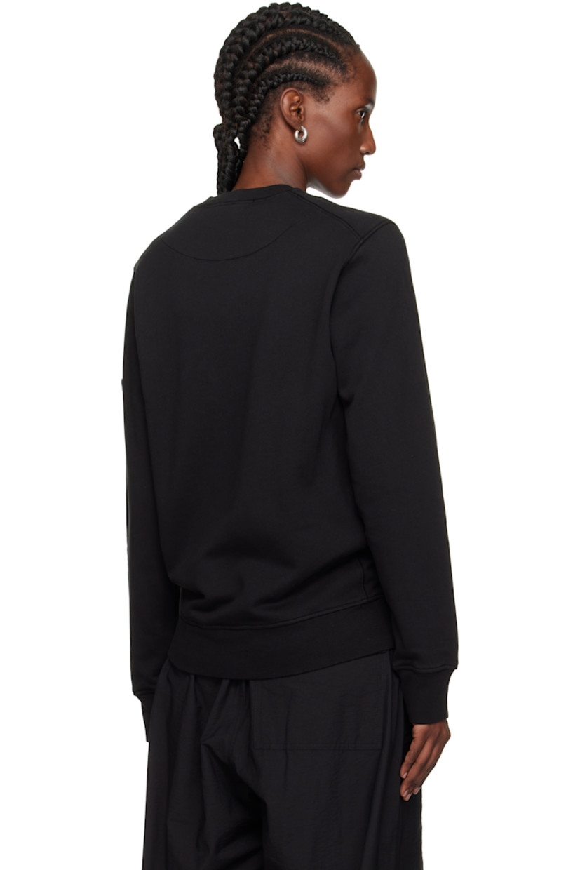 Garment-dyed organic cotton fleece sweatshirt. 

· Overlock stitching throughout
· Rib-knit crewneck, hem, and cuffs
· Detachable felted logo patch at sleeve

Supplier color: Black