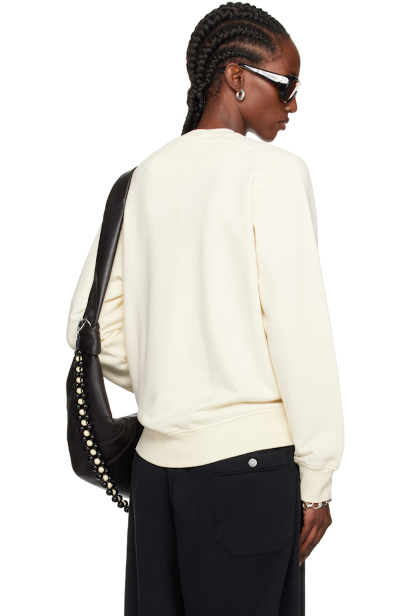 Garment-dyed organic cotton fleece sweatshirt. 

· Overlock stitching throughout
· Rib-knit crewneck, hem, and cuffs
· Detachable felted logo patch at sleeve

Supplier color: Ivory