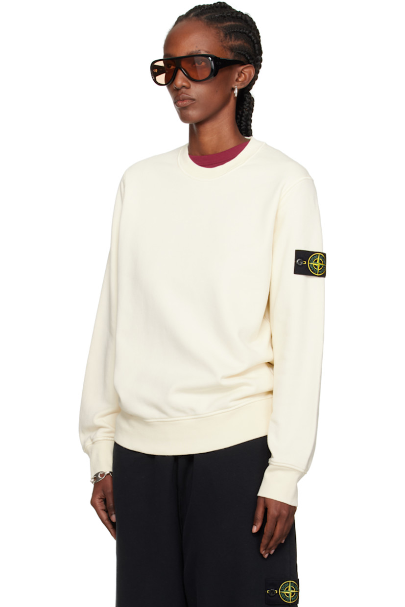 Garment-dyed organic cotton fleece sweatshirt. 

· Overlock stitching throughout
· Rib-knit crewneck, hem, and cuffs
· Detachable felted logo patch at sleeve

Supplier color: Ivory
