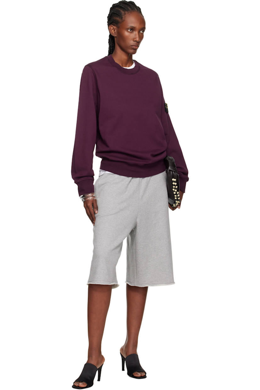 Garment-dyed organic cotton fleece sweatshirt. 

· Overlock stitching throughout
· Rib-knit crewneck, hem, and cuffs
· Detachable felted logo patch at sleeve

Supplier color: Amaranth