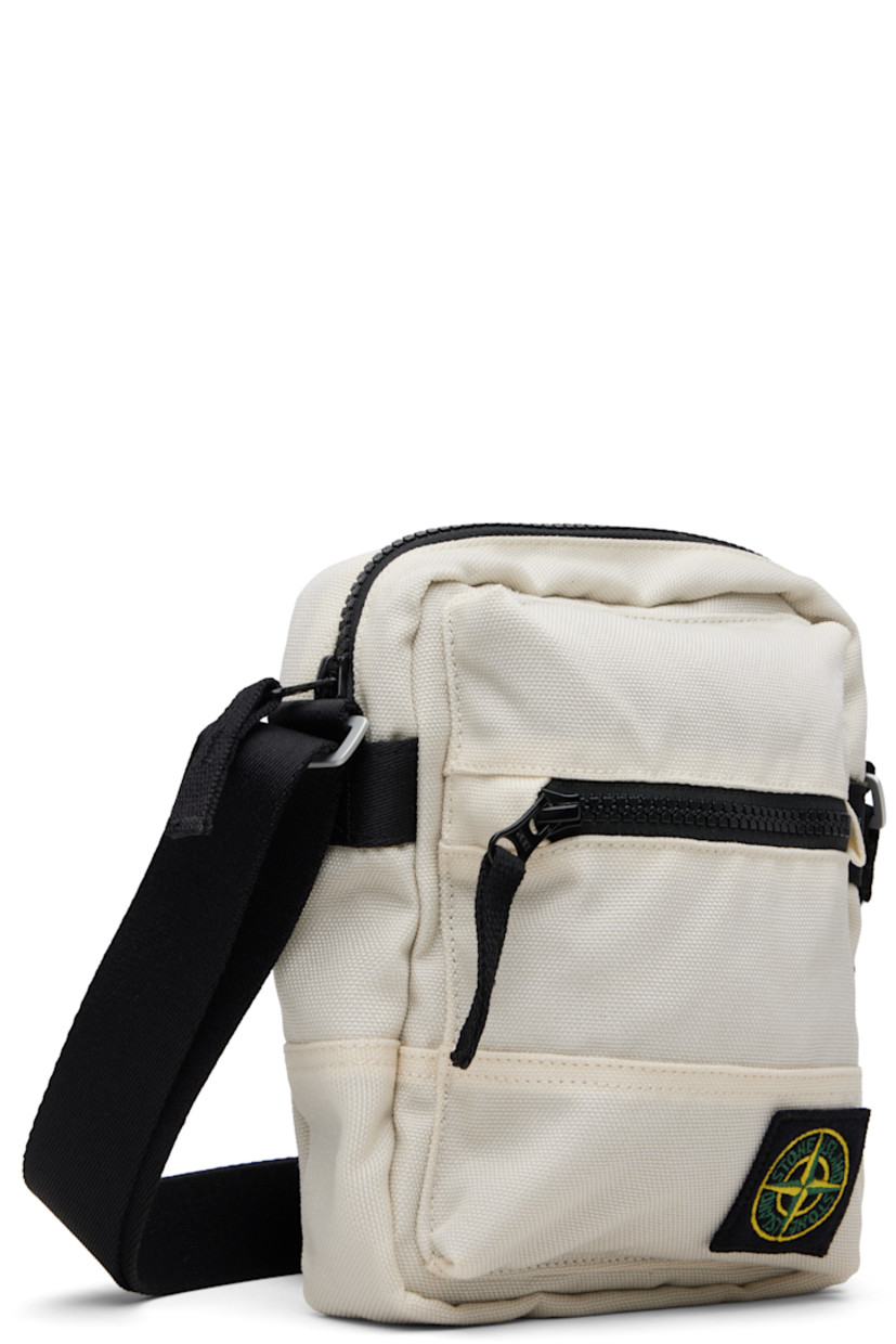 CORDURA® canvas pouch.

· Adjustable crossbody strap
· Zip pocket and logo patch at face
· Flap pocket at back face
· Zip closure
· Ripstop lining
· H8" x W7" x D2.5"

Supplier color: Ivory
