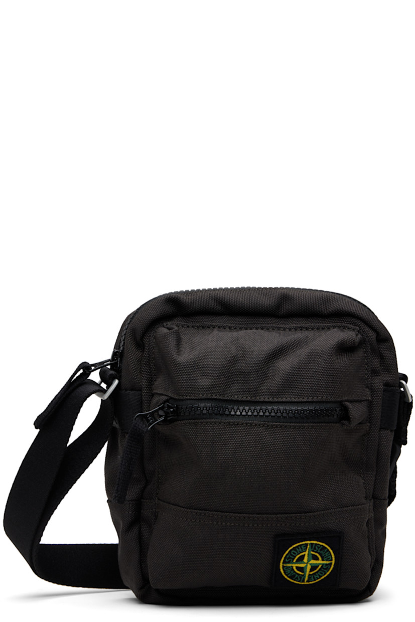 CORDURA® canvas pouch.

· Adjustable crossbody strap
· Zip pocket and logo patch at face
· Flap pocket at back face
· Zip closure
· Ripstop lining
· H8" x W7" x D2.5"

Supplier color: Lead grey