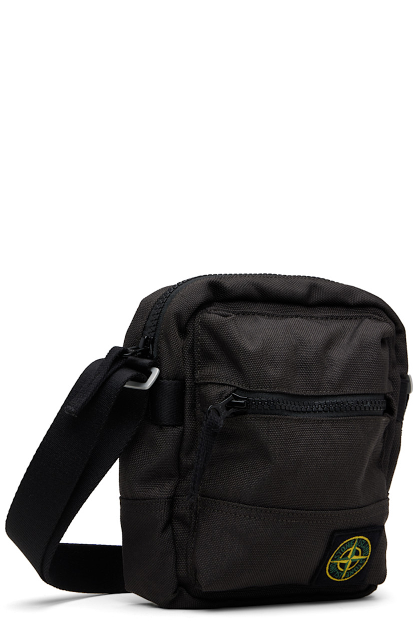 CORDURA® canvas pouch.

· Adjustable crossbody strap
· Zip pocket and logo patch at face
· Flap pocket at back face
· Zip closure
· Ripstop lining
· H8" x W7" x D2.5"

Supplier color: Lead grey