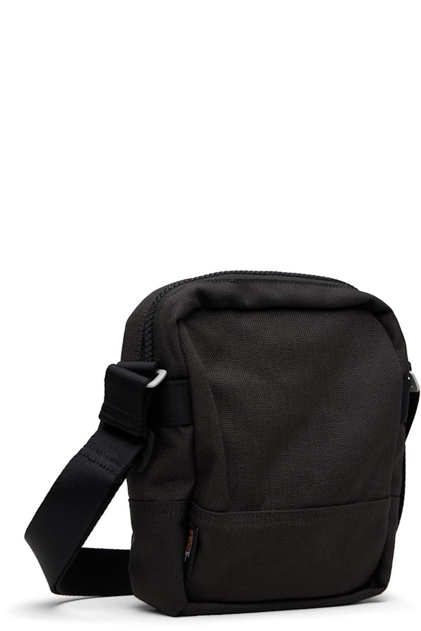 CORDURA® canvas pouch.

· Adjustable crossbody strap
· Zip pocket and logo patch at face
· Flap pocket at back face
· Zip closure
· Ripstop lining
· H8" x W7" x D2.5"

Supplier color: Lead grey