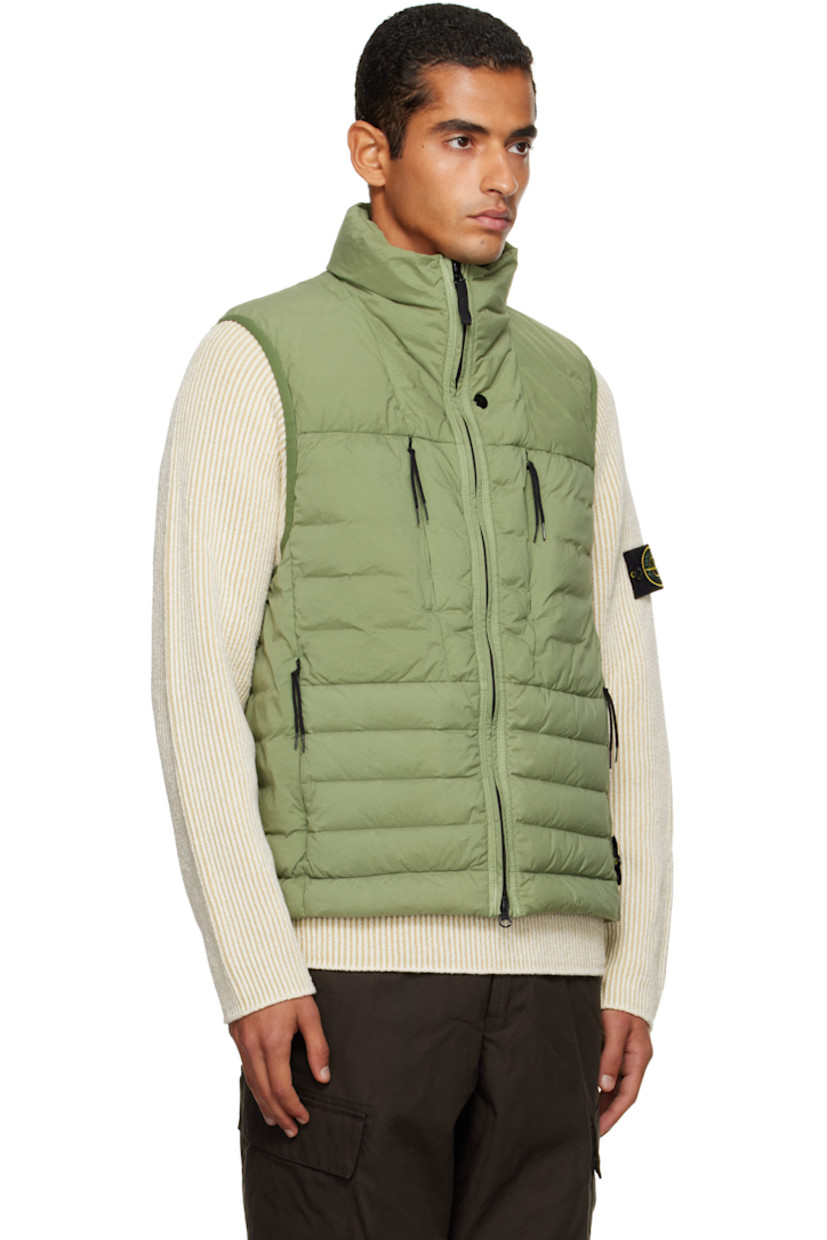 Down-filled and quilted stretch nylon taffeta vest.

· RDS-certified down
· Garment-dyed
· Stand collar
· Two-way zip closure
· Zip pockets at chest and waist
· Bungee-style drawstring at hem
· Detachable felted logo patch at side seam
· Elasticized armscyes
· Fully lined

Supplier color: Sage

Fill: 90% duck down, 10% duck feathers.