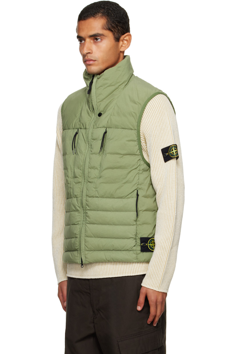 Down-filled and quilted stretch nylon taffeta vest.

· RDS-certified down
· Garment-dyed
· Stand collar
· Two-way zip closure
· Zip pockets at chest and waist
· Bungee-style drawstring at hem
· Detachable felted logo patch at side seam
· Elasticized armscyes
· Fully lined

Supplier color: Sage

Fill: 90% duck down, 10% duck feathers.