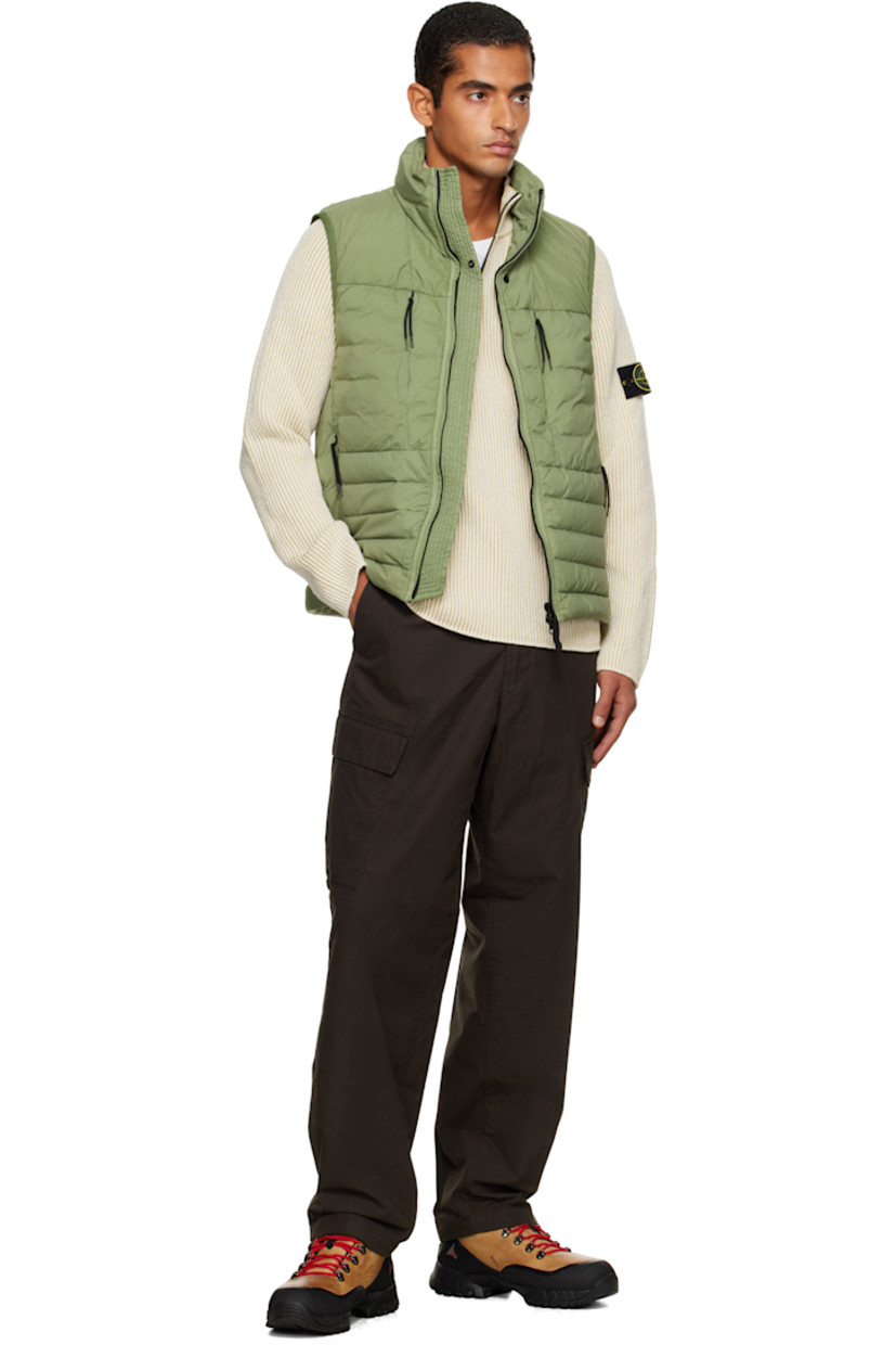 Down-filled and quilted stretch nylon taffeta vest.

· RDS-certified down
· Garment-dyed
· Stand collar
· Two-way zip closure
· Zip pockets at chest and waist
· Bungee-style drawstring at hem
· Detachable felted logo patch at side seam
· Elasticized armscyes
· Fully lined

Supplier color: Sage

Fill: 90% duck down, 10% duck feathers.