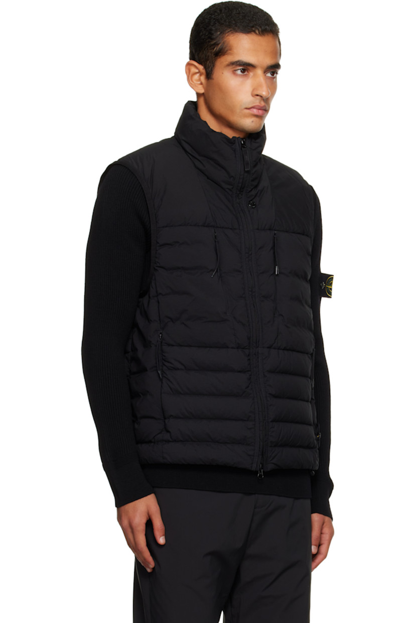 Down-filled and quilted stretch nylon taffeta vest.

· RDS-certified down
· Garment-dyed
· Stand collar
· Two-way zip closure
· Zip pockets at chest and waist
· Bungee-style drawstring at hem
· Detachable felted logo patch at side seam
· Elasticized armscyes
· Fully lined

Supplier color: Black

Fill: 90% duck down, 10% duck feather.