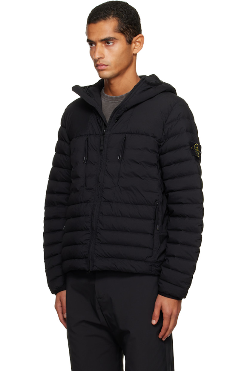 Down-filled and quilted stretch nylon taffeta jacket.

· RDS-certified down
· Garment-dyed
· Elasticized trim at hood and cuffs
· Two-way zip closure
· Zip pockets at chest and waist
· Bungee-style drawstring at hem
· Detachable felted logo patch at sleeve
· Fully lined

Supplier color: Black

Fill: 90% duck down, 10% duck feather.