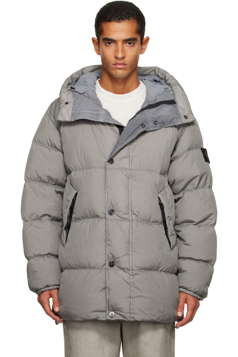 Down-filled, quilted, and crinkled recycled nylon taffeta jacket. 

· RDS-certified down
· Garment-dyed
· Wind- and water-resistant  
· Bungee-style drawstring at hood and hem
· Concealed two-way zip closure
· Press-stud placket
· Zip pockets at waist
· Detachable felted logo patch at sleeve
· Elasticized cuffs
· Patch pocket at resin-coated interior 
· Full taffeta lining 

Supplier color: Cement 

Fill 1: 80% duck down, 20% duck feather. Fill 2: 100% polyester.