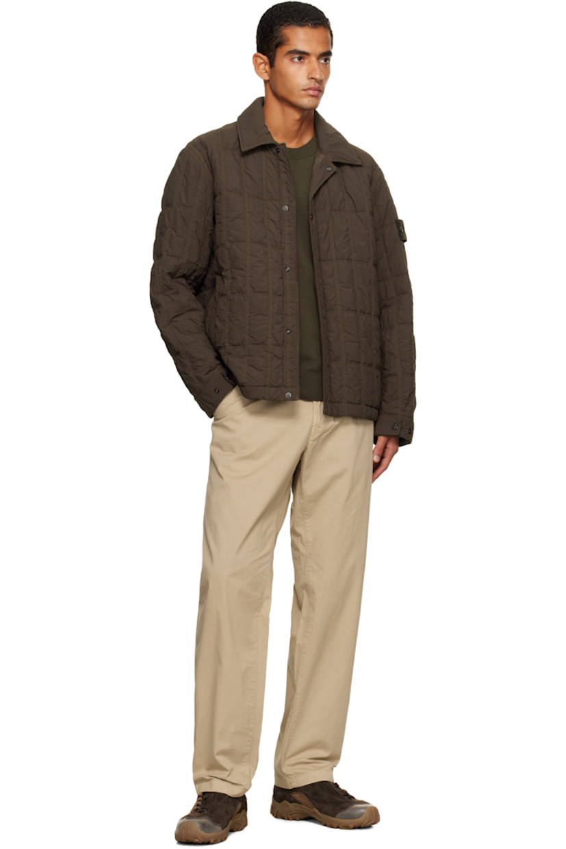 Insulated and quilted recycled nylon taffeta jacket.

· Spread collar
· Press-stud closure
· Seam pockets
· Detachable felted logo patch at sleeve
· Adjustable press-stud tab at cuffs
· Full satin lining

Part of the Ghost collection.

Supplier color: Dark brown