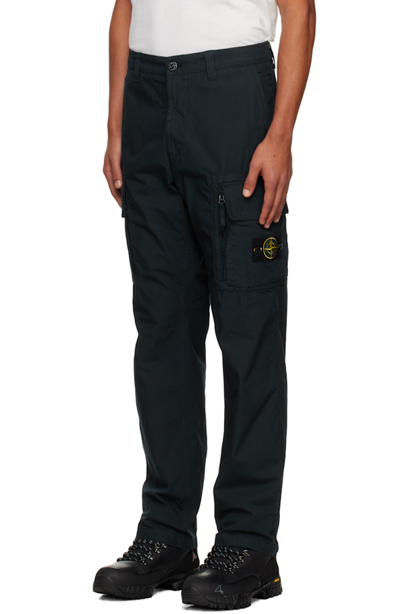 Garment-dyed cotton canvas cargo pants.

· Belt loops
· Three-pocket styling
· Zip fly
· Flap pockets and zip pocket at legs
· Detachable logo patch at leg

Supplier color: Navy blue