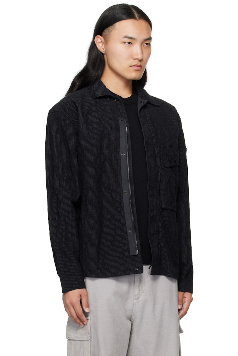 Garment-dyed cotton-blend corduroy jacket.

· Spread collar
· Concealed zip closure with press-stud placket
· Press-stud flap pocket at chest
· Detachable logo patch at sleeve
· Press-stud fastening at cuffs
· Press-stud pocket at interior
· Unlined

Supplier color: Black