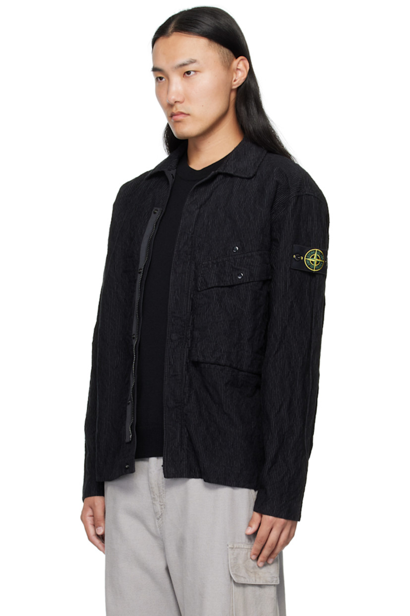 Garment-dyed cotton-blend corduroy jacket.

· Spread collar
· Concealed zip closure with press-stud placket
· Press-stud flap pocket at chest
· Detachable logo patch at sleeve
· Press-stud fastening at cuffs
· Press-stud pocket at interior
· Unlined

Supplier color: Black