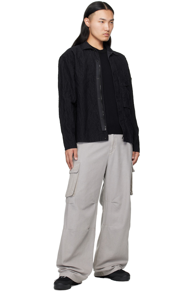 Garment-dyed cotton-blend corduroy jacket.

· Spread collar
· Concealed zip closure with press-stud placket
· Press-stud flap pocket at chest
· Detachable logo patch at sleeve
· Press-stud fastening at cuffs
· Press-stud pocket at interior
· Unlined

Supplier color: Black