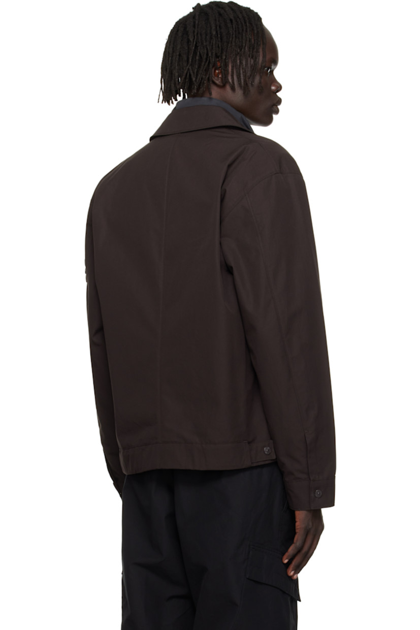 Organic cotton canvas overshirt. 

· Spread collar 
· Two-way zip closure
· Flap pocket at chest
· Seam pockets at waist
· Detachable felted logo patch at sleeve
· Press-stud barrel cuffs
· Adjustable press-stud tabs at back hem 

Part of the Ghost collection.

Supplier color: Dark brown