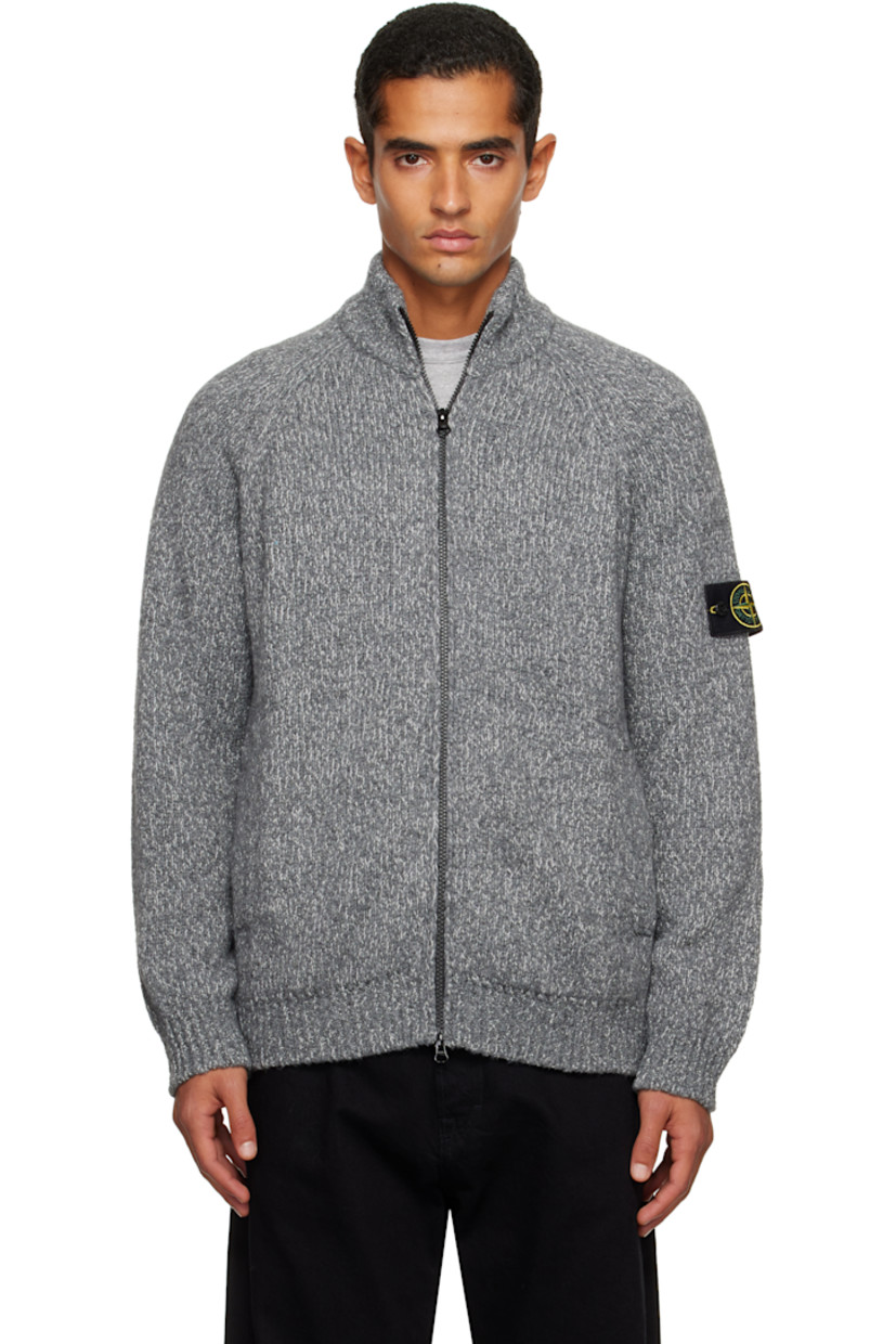 Knit virgin wool-blend cardigan. 

· Rib-knit stand collar, hem, and cuffs
· Two-way zip closure
· Patch pockets at waist
· Raglan sleeves
· Detachable felted logo patch at sleeve

Supplier color: Cement melange