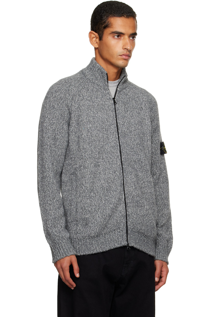 Knit virgin wool-blend cardigan. 

· Rib-knit stand collar, hem, and cuffs
· Two-way zip closure
· Patch pockets at waist
· Raglan sleeves
· Detachable felted logo patch at sleeve

Supplier color: Cement melange