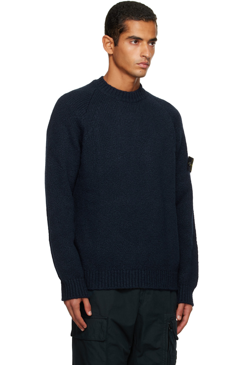 3-gauge knit virgin wool-blend sweater. 

· Rib-knit crewneck, hem, and cuffs
· Raglan sleeves
· Detachable felted logo patch at sleeve

Supplier color: Navy blue