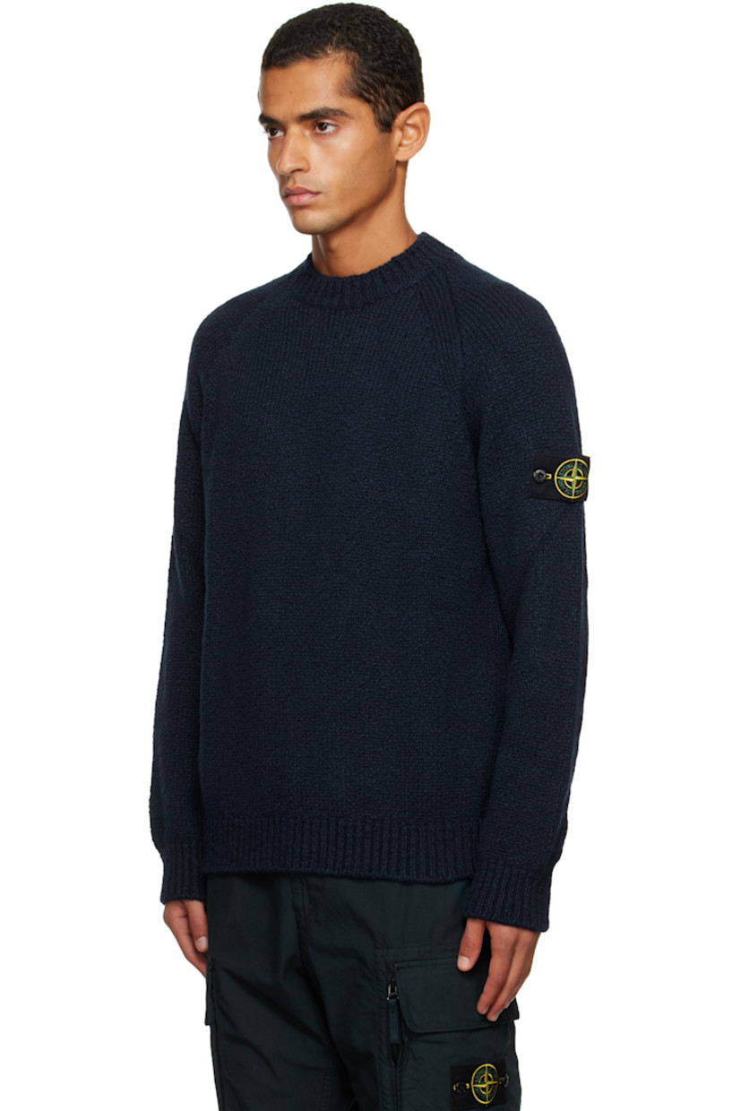 3-gauge knit virgin wool-blend sweater. 

· Rib-knit crewneck, hem, and cuffs
· Raglan sleeves
· Detachable felted logo patch at sleeve

Supplier color: Navy blue