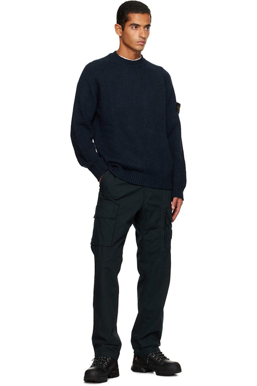 3-gauge knit virgin wool-blend sweater. 

· Rib-knit crewneck, hem, and cuffs
· Raglan sleeves
· Detachable felted logo patch at sleeve

Supplier color: Navy blue