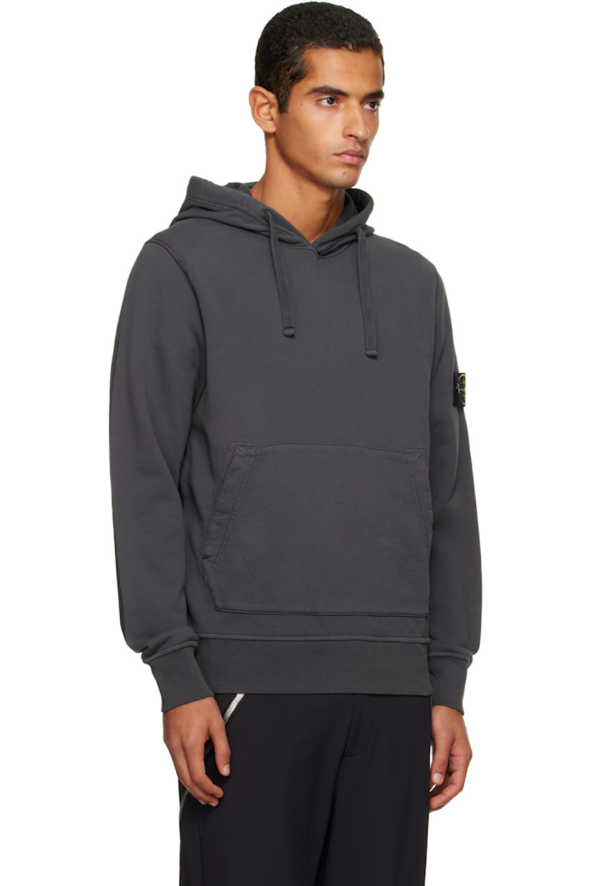Organic cotton French terry hoodie.

· Garment-dyed
· Drawstring at hood
· Kangaroo pocket at waist
· Rib-knit hem and cuffs
· Detachable felted logo patch at sleeve

Supplier color: Lead grey