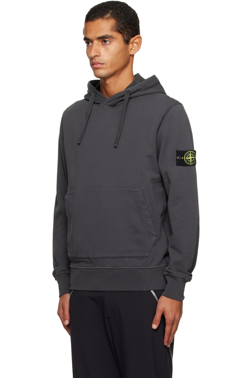 Organic cotton French terry hoodie.

· Garment-dyed
· Drawstring at hood
· Kangaroo pocket at waist
· Rib-knit hem and cuffs
· Detachable felted logo patch at sleeve

Supplier color: Lead grey