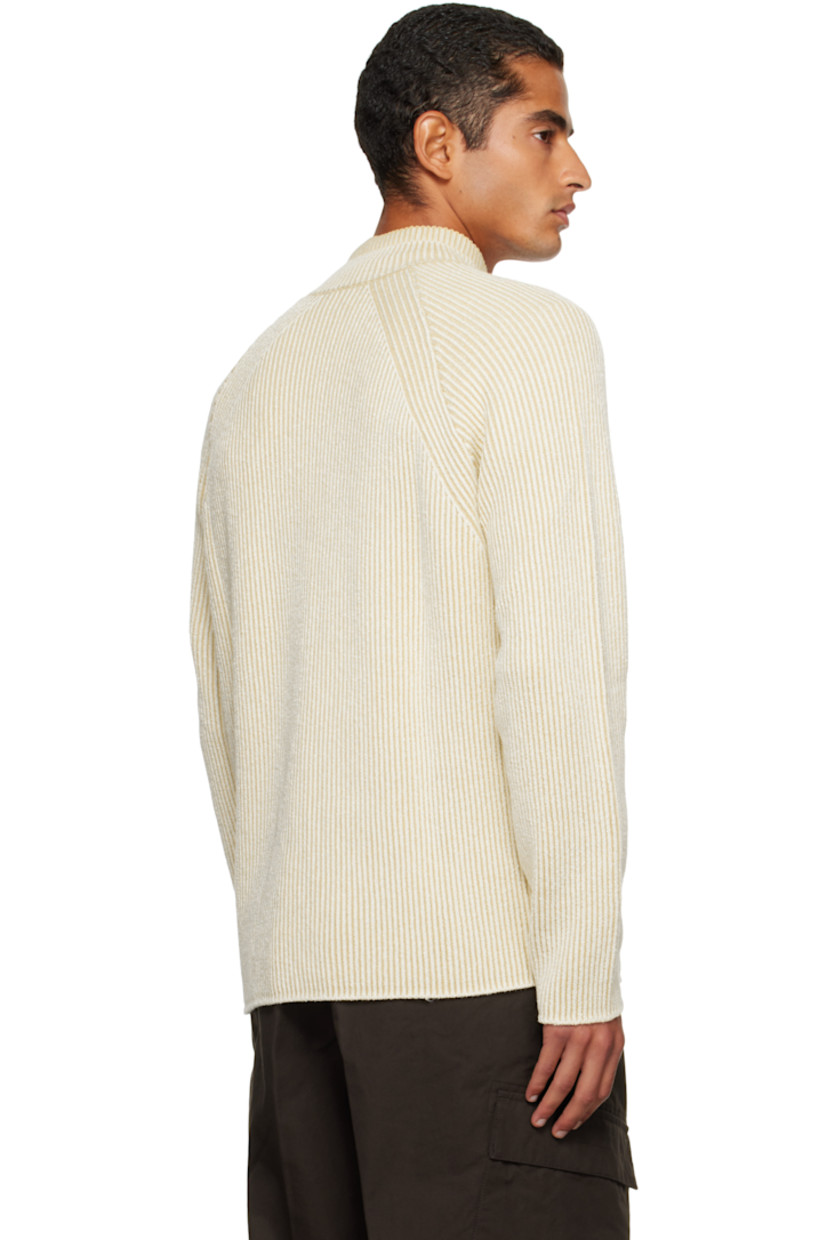 Rib-knit stretch virgin wool- and cotton-blend sweater.

· Stand collar
· Half-zip closure
· Raglan sleeves
· Detachable felted logo patch at sleeve

Supplier color: Ivory